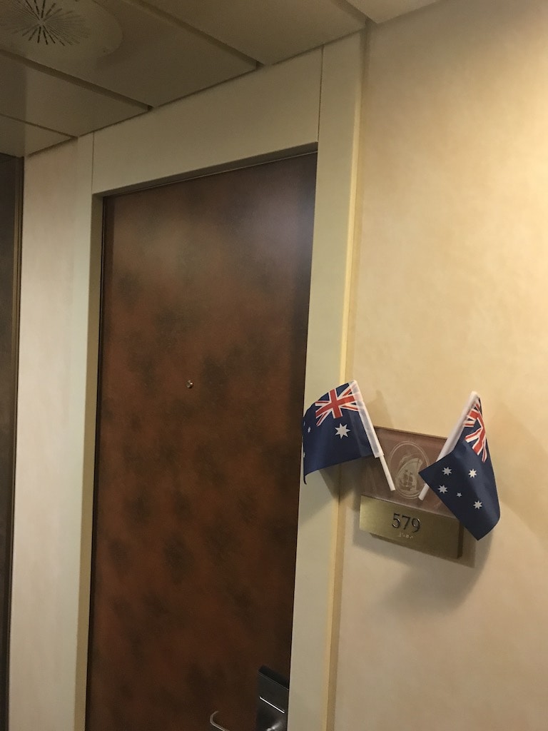 flags on Holland America cruise cabin door