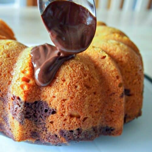 Pumpkin bundt cake with chocolate icing.