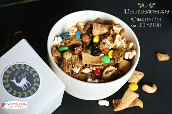 White bowl of crunchy and sweet snack mix.
