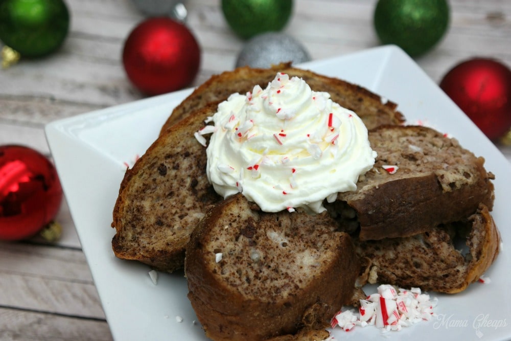 Candy cane French Toast on a white plate with Christmas balls.