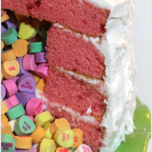 Red velvet cake with sweetheart candies in the middle.