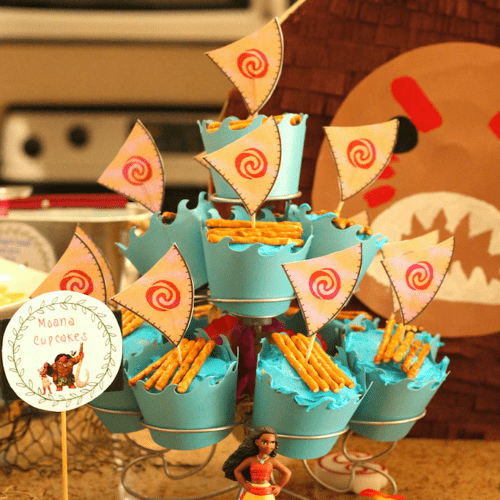 Cupcakes with blue icing, pretzels, and sails
