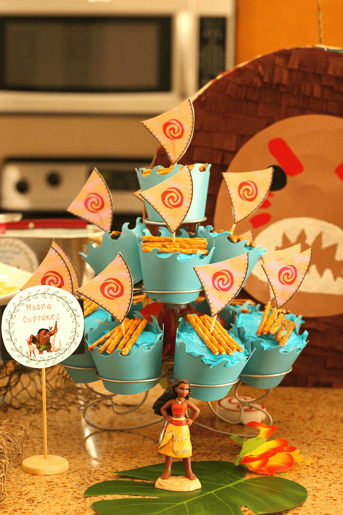 Cupcakes with blue icing, pretzels, and sails