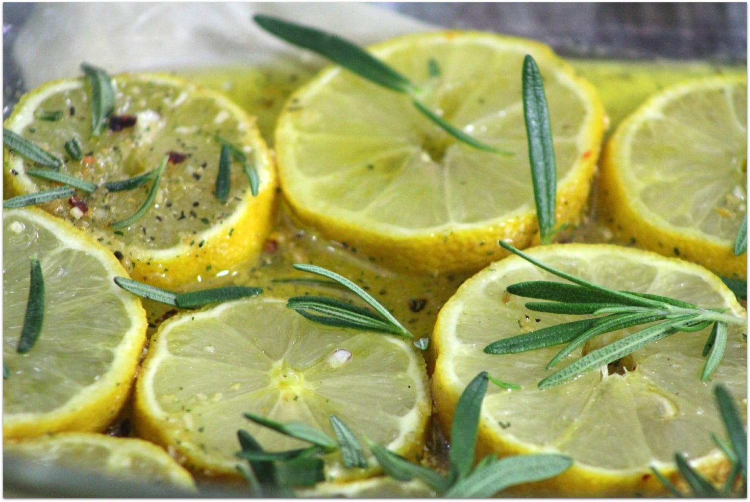 Lemons with rosemary and seasoning.