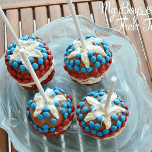 Red, white, and blue candy apples with M & Ms.
