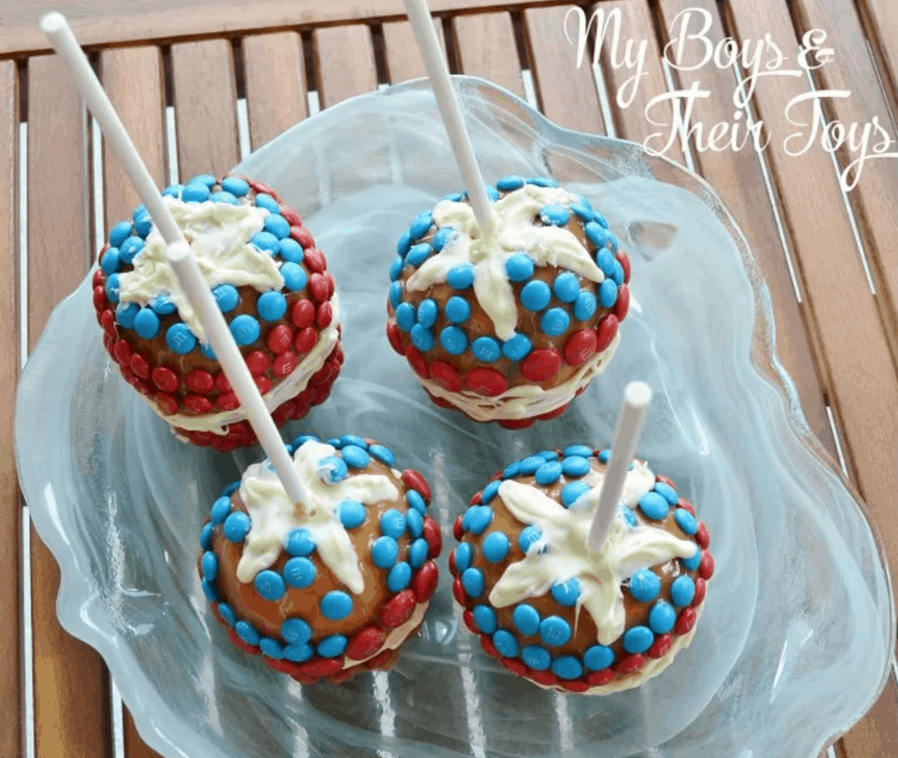 Red, white, and blue candy apples with M & Ms.