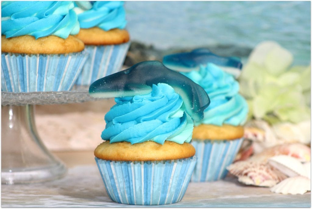 This Shark Week Cupcake dessert recipe is pretty popular right now with the event right around the corner. Did you know Shark Week is the most watched show in the 26-year history of the Discovery Channel? Make this easy dessert and surprise the kids with a special treat! Also great for summer pool parties and birthdays!