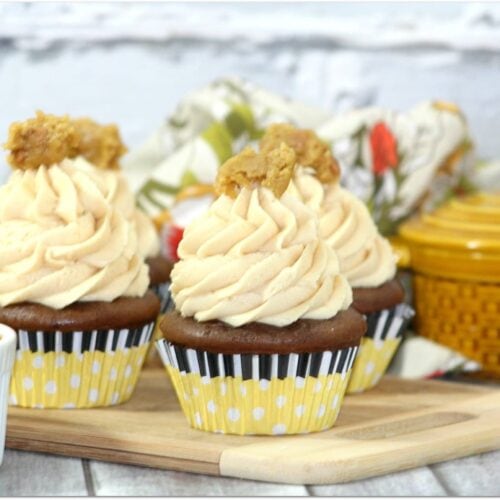 Chocolate cupcakes with peanut butter frosting and peanut butter inside.