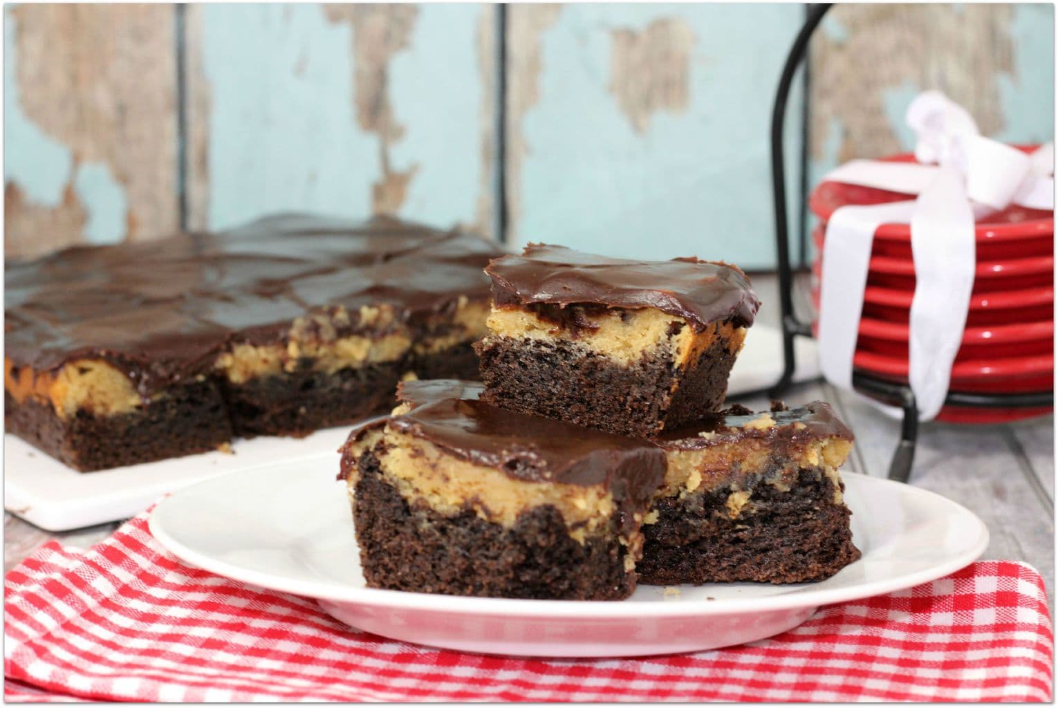 These Peanut Butter Chocolate Ooey Gooey Bars are so delicious, your family is going to ask for this recipe over and over again! Any dessert recipe with peanut butter and chocolate is a hit with my family! Can you imagine these warm with ice cream? It's the perfect after dinner dessert or after school treat!