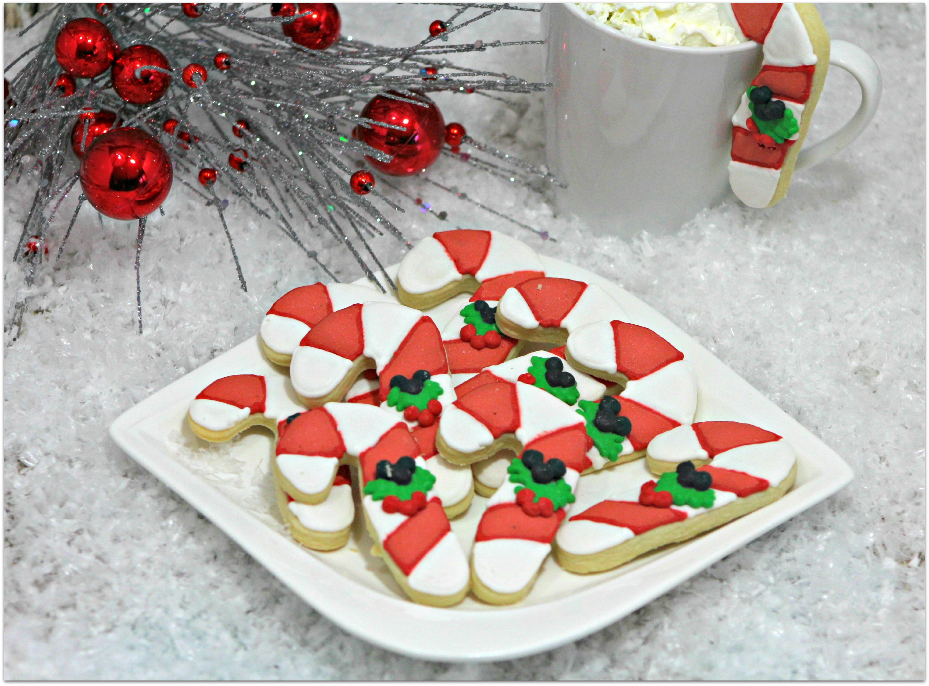 These Hidden Mickey Candy Cane Cookies are the perfect dessert for Disney fans! Need a dessert for school? Your child's classmates will love seeing these delivered to their class party!