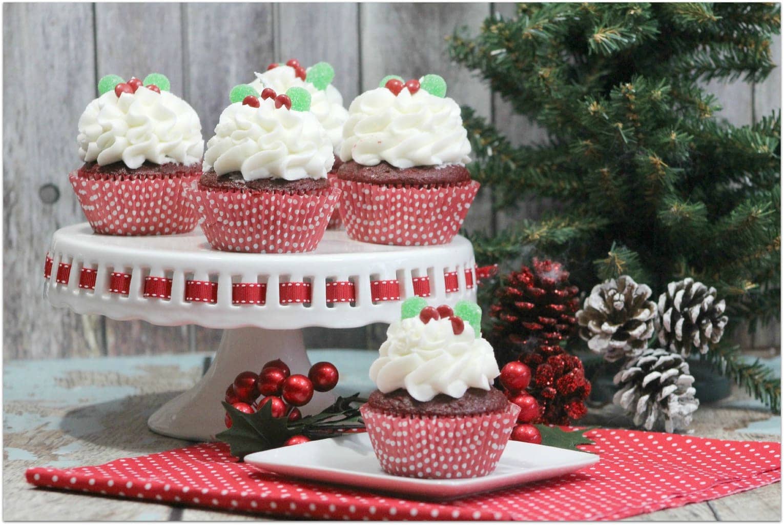 These Holly Red Velvet Cupcakes are so festive, and the perfect dessert to take to a Christmas party! The recipe is easy, so you won't spend hours in the kitchen. You're welcome! This will end up being your go-to holiday dessert recipe!