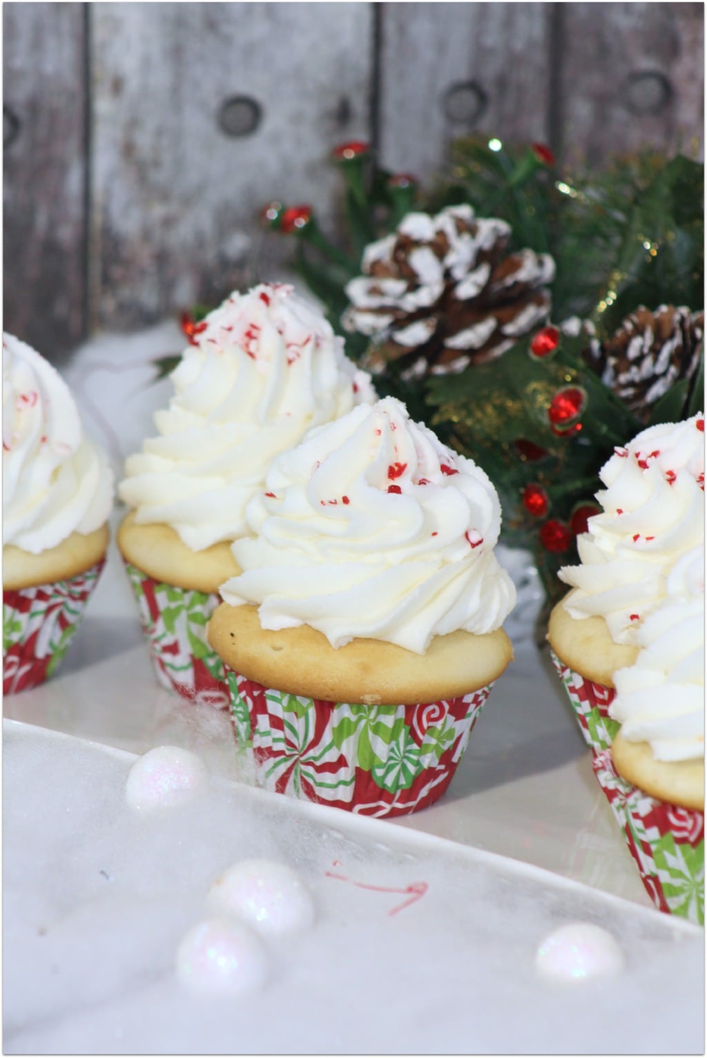 Who wants a Christmas cupcake? I’ve told you before that cupcakes are one of my favorite desserts for parties and celebrations, especially when kids are involved. This is an easy dessert recipe, but the result is just beautiful! As I always say, don’t buy cupcakes when you can DIY! Want to be able to produce a beautiful topping of frosting like you see here? My secret is the Wilton Frosting gun! You won’t believe how easy it is to produce professional looking desserts!