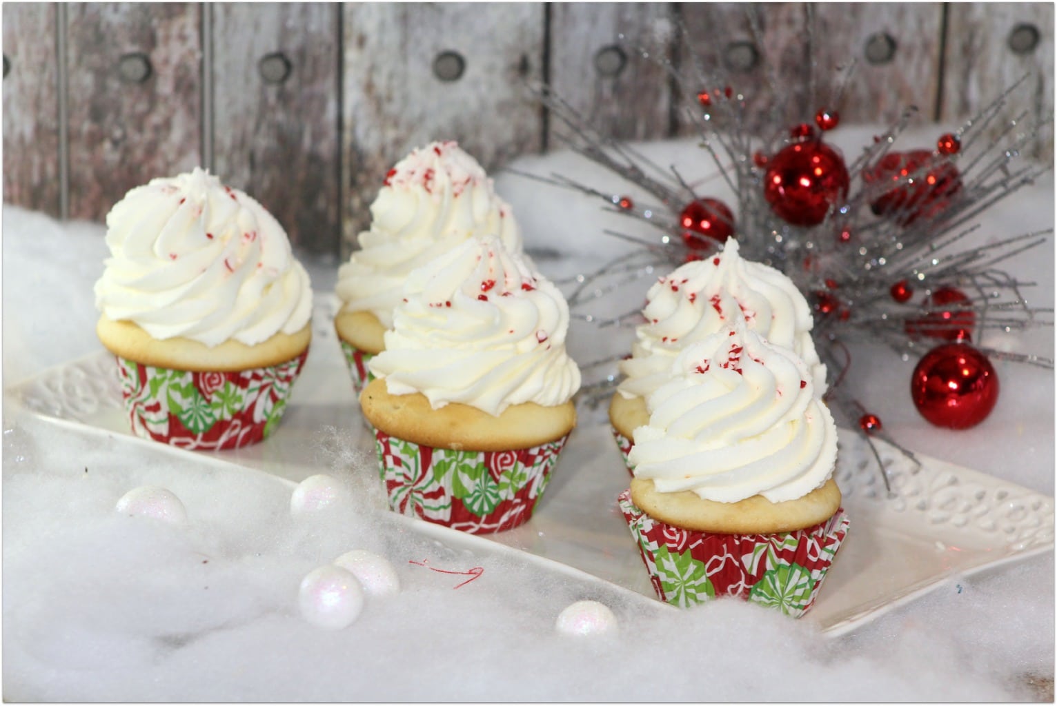 Who wants a Christmas cupcake? I’ve told you before that cupcakes are one of my favorite desserts for parties and celebrations, especially when kids are involved. This is an easy dessert recipe, but the result is just beautiful! As I always say, don’t buy cupcakes when you can DIY! Want to be able to produce a beautiful topping of frosting like you see here? My secret is the Wilton Frosting gun! You won’t believe how easy it is to produce professional looking desserts!