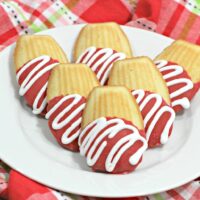 We love cookies around here, and these Chocolate Covered Madeleines are not only delicious, they are so pretty! Make it the centerpiece on your kitchen table for Valentine's Day, or add them to a pretty Valentine's basket for your kids! Need a dessert for the classroom party? Everyone will love these cookies, and it's an easy recipe, too!