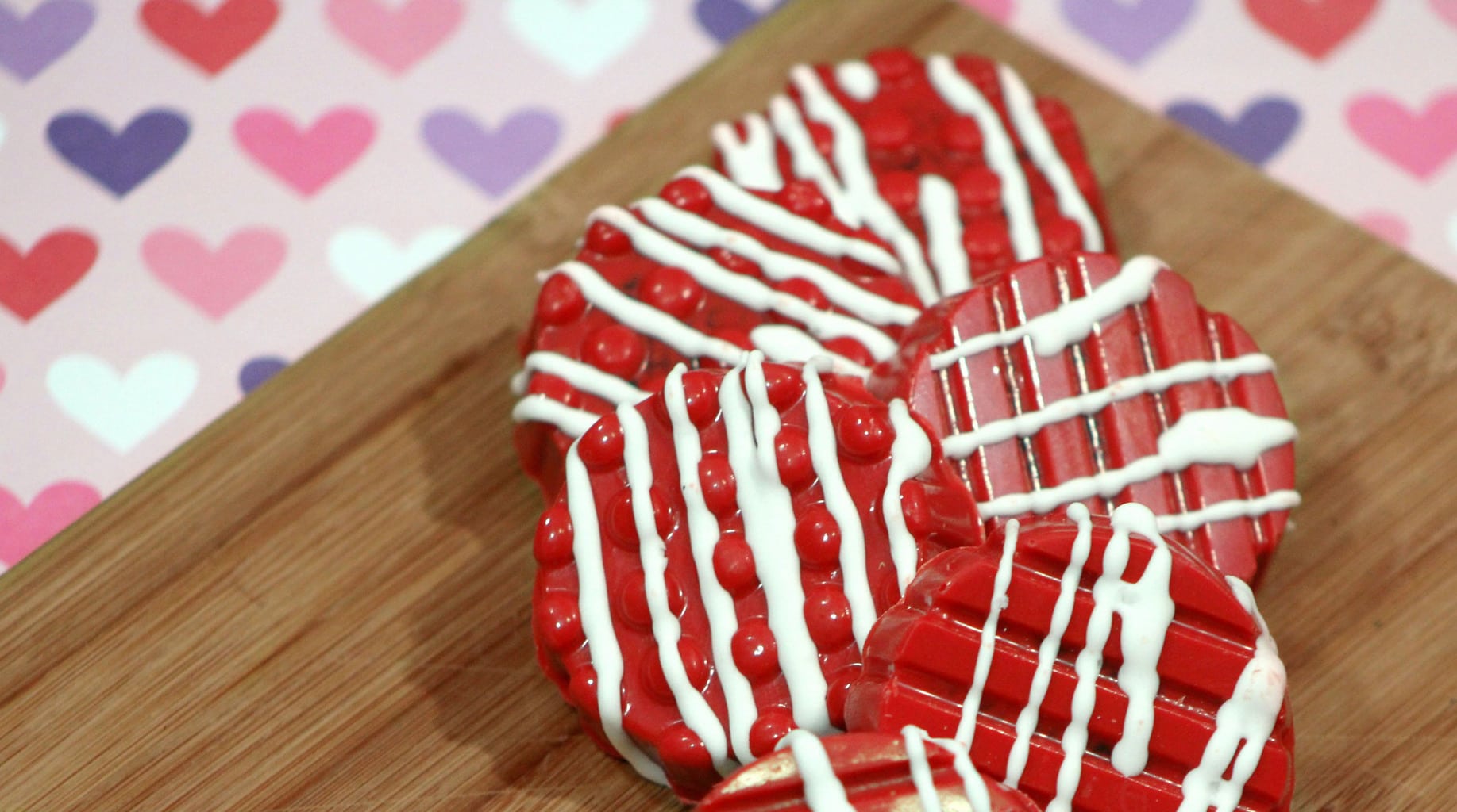 These chocolate dipped Valentine's Oreos are the bomb! If you're looking for a simple way to make a festive dessert, this easy recipe is for you! You'll have fun in the kitchen with your kids making them and be a rockstar mom at the class party!