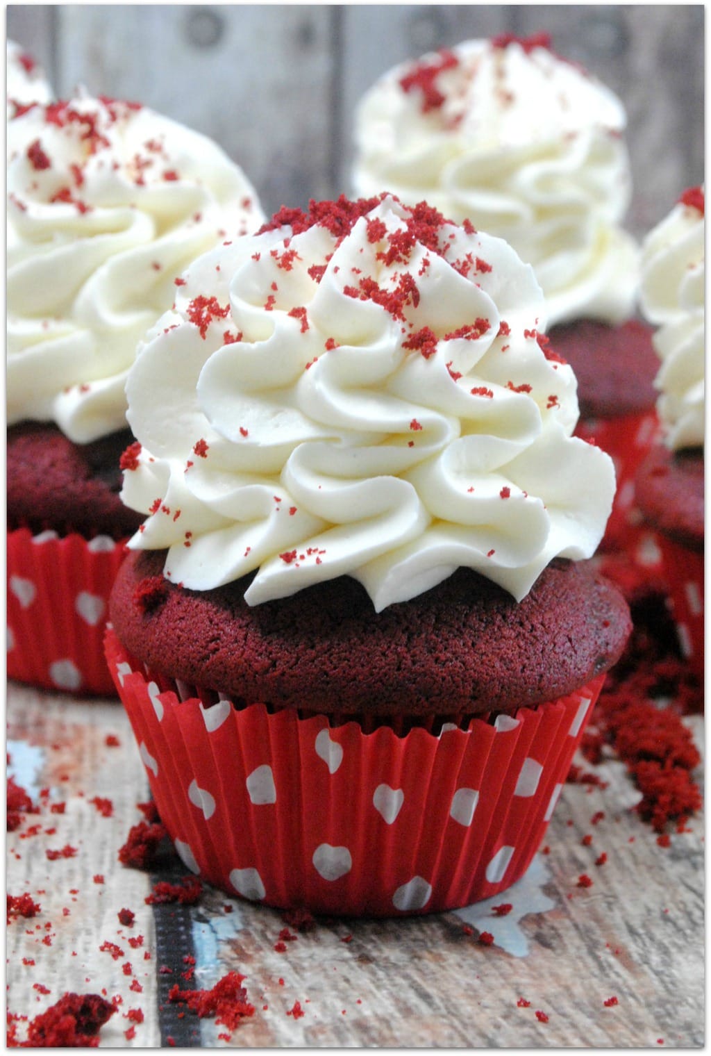 This classic red velvet cupcake recipe is the deliciousness of red velvet cake in a smaller portion, perfect for a party! One thing I love about cupcakes is that you don't need a plate and fork. When I’m bringing a dessert to a party or school event, I don’t want to have to mess with bringing plates and forks, too. Everyone will love this decadent dessert recipe, and you will love that it’s easy! No one wants to be in the kitchen for hours, including me! 