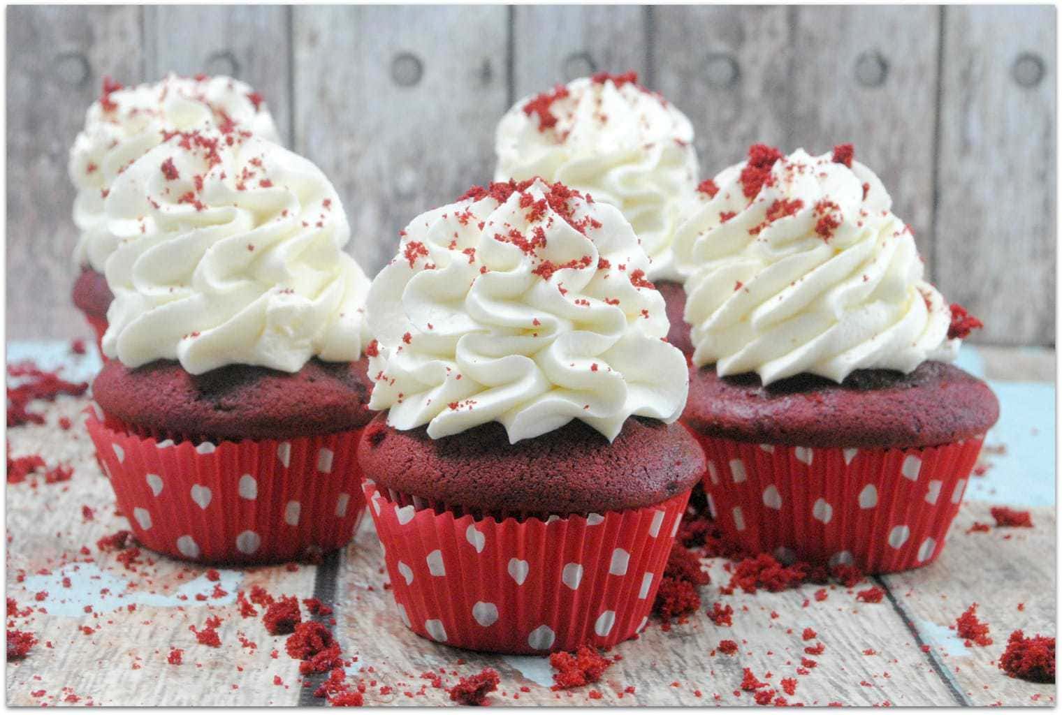 This classic red velvet cupcake recipe is the deliciousness of red velvet cake in a smaller portion, perfect for a party! One thing I love about cupcakes is that you don't need a plate and fork. When I’m bringing a dessert to a party or school event, I don’t want to have to mess with bringing plates and forks, too. Everyone will love this decadent dessert recipe, and you will love that it’s easy! No one wants to be in the kitchen for hours, including me! 
