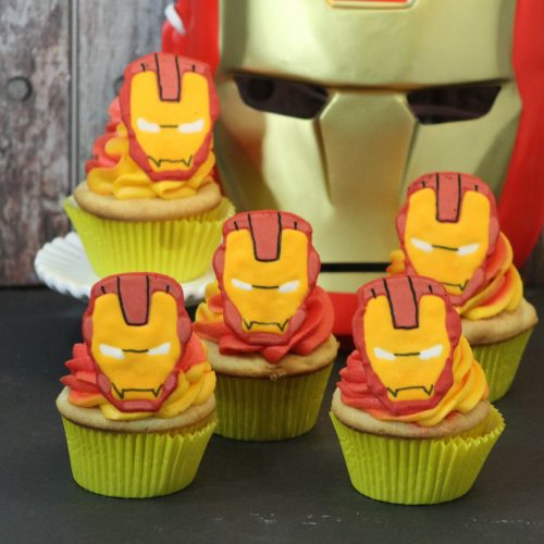 Iron Man Cupcakes with Iron Man Mask in background.