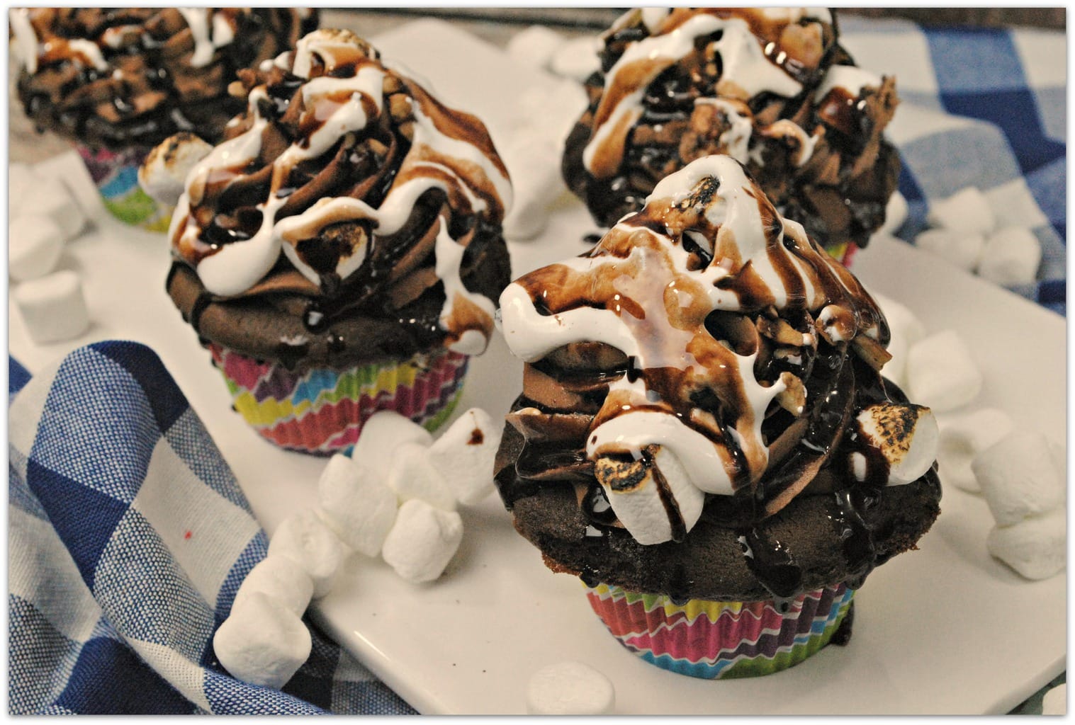 What could be better than Mudslide Cupcakes? There is one dessert I always want to order when it's on the menu, and that's a mudslide. However it's made, you know it's going to be good, right? I mean, when you combine chocolate, marshmallow fluff, toasted marshmallows, and crunchy walnuts, you just can't go wrong.