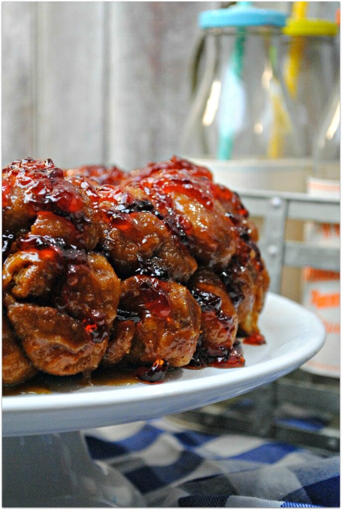 What could be better than a Peanut Butter and Jelly sandwich? Peanut Butter and Jelly Monkey Bread! The deliciousness of Monkey Bread combined with the homey flavors of PB & J is just fantastic, and it's so easy to make! Head to the kitchen with the kids and whip up this amazing dessert today! Your kids will love it! Take this to a party and be the rockstar guest! 