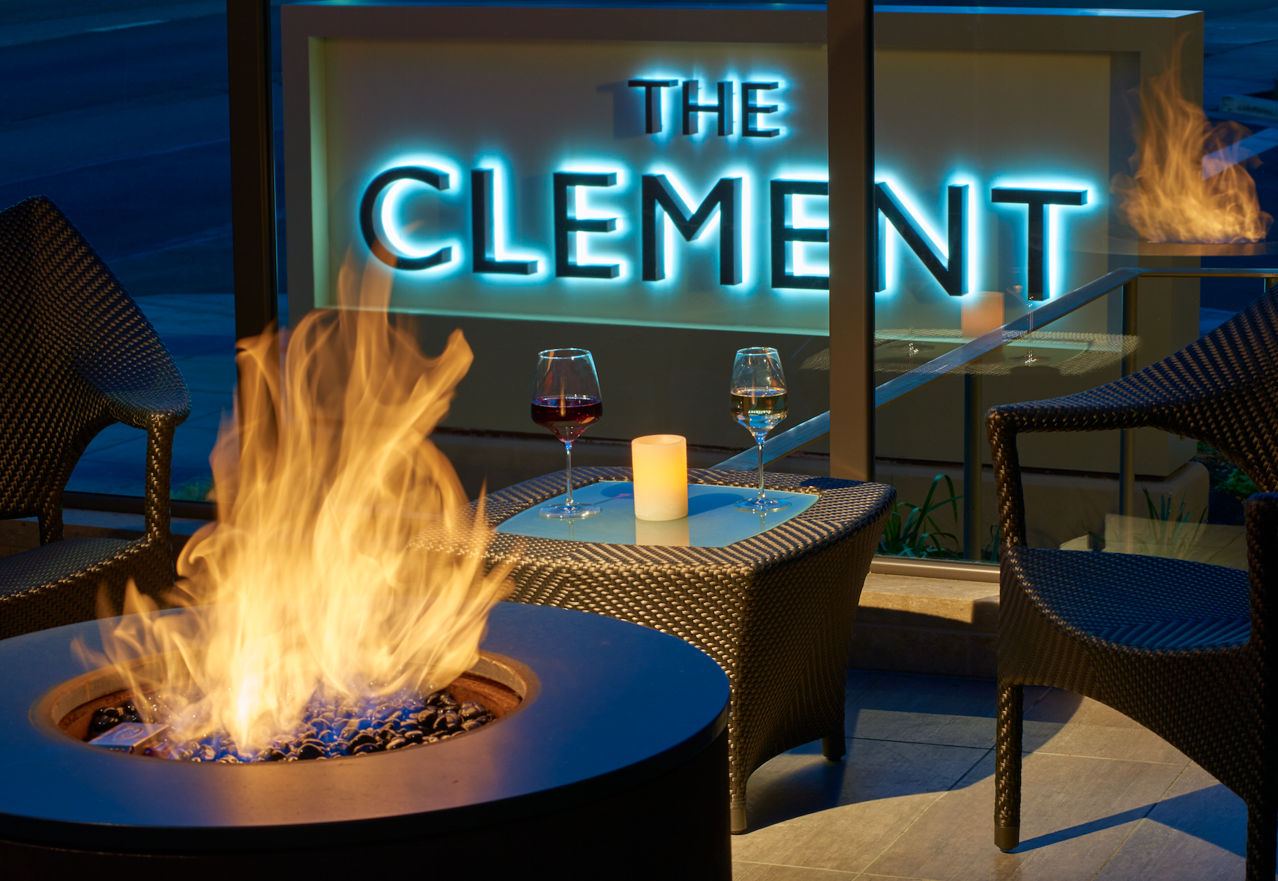 Fire pit and glasses of wine at the Clement Palo Alto in the heart of Silicon Valley.