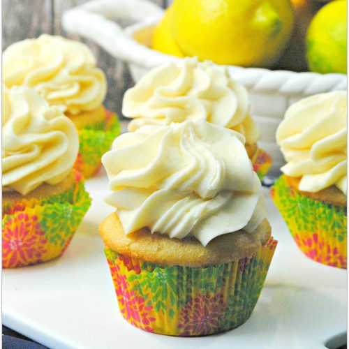 Lemon cupcakes on white platter.