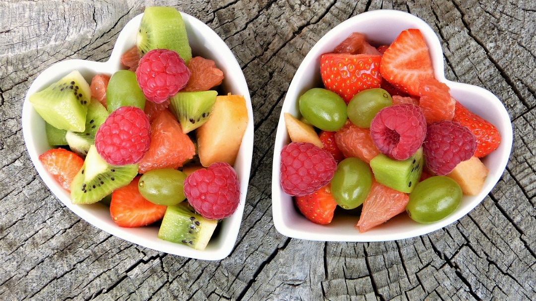 Fruit in heart shaped white cups.