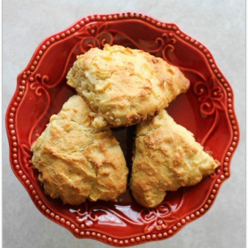 Apple scones on a red plate.