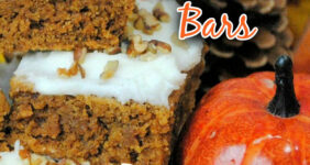 Pumpkin bars with white icing and nuts on top.