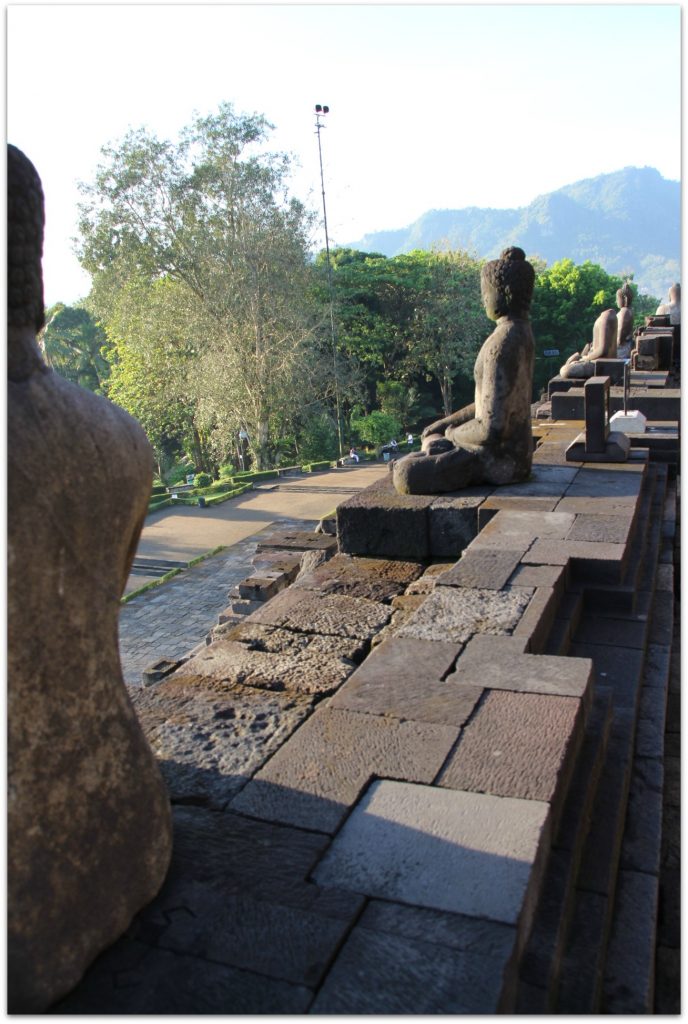 Stone Buddha statues at Borobudur Temple.