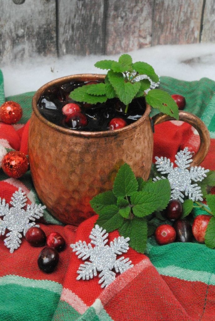 Cranberry cocktail in a copper mug.