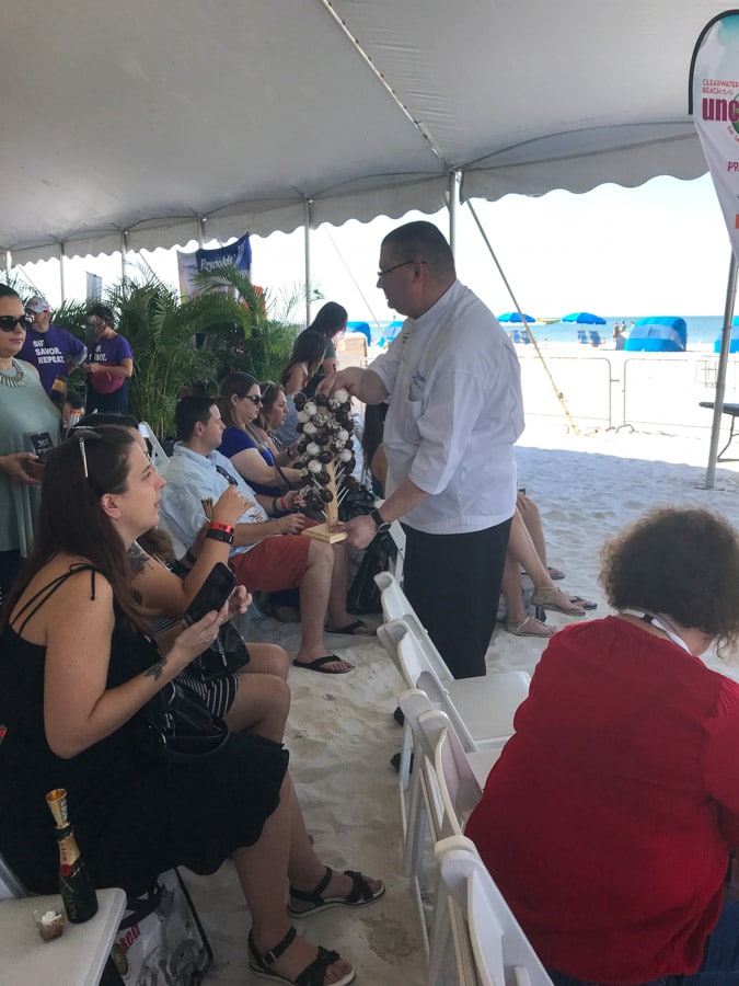 Chef teaching cooking class at Clearwater Beach Uncorked Wine Festival.