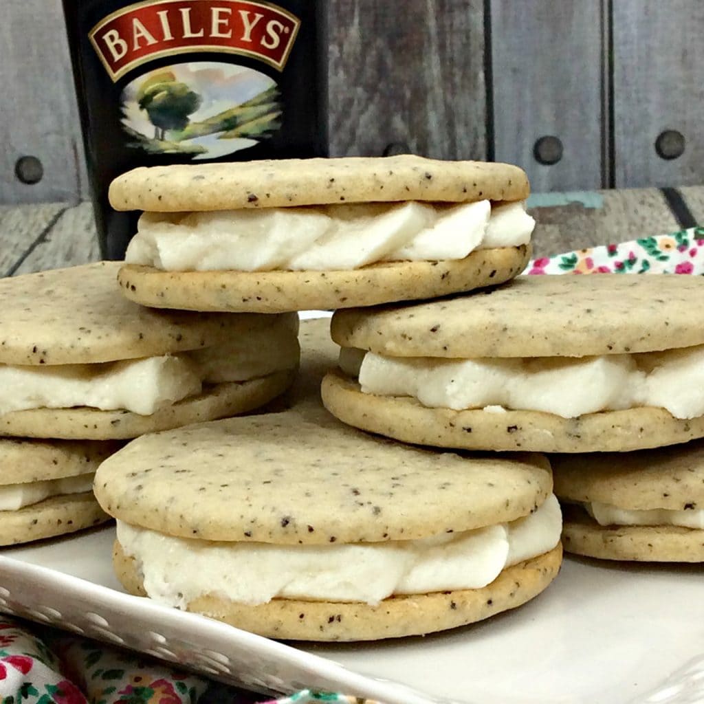 Plate of cookies with Baileys in the background.