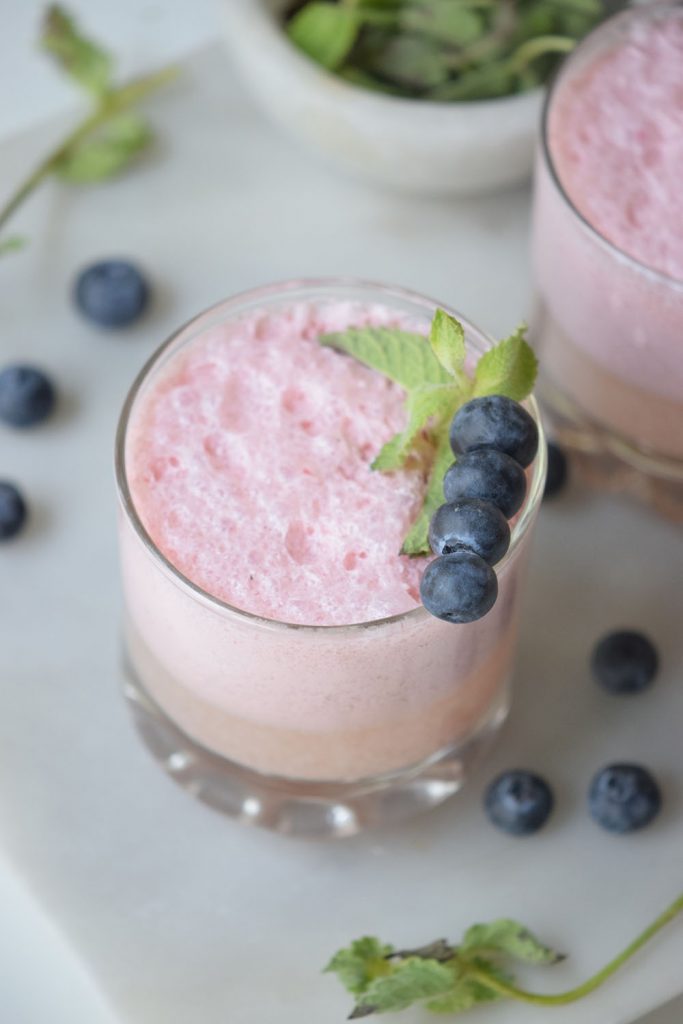 You are going to love the flavors in this Berry Mint Yogurt Smoothie. We're switching from eating high-sugar fruit yogurt to blending plain Greek yogurt with fresh fruit in a delicious and healthy smoothie.