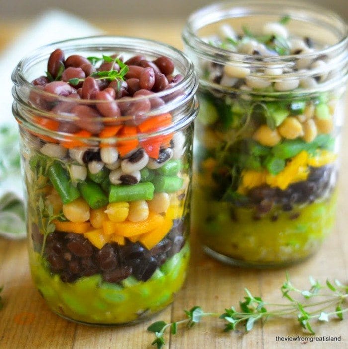 Two mason jars filled with salad.