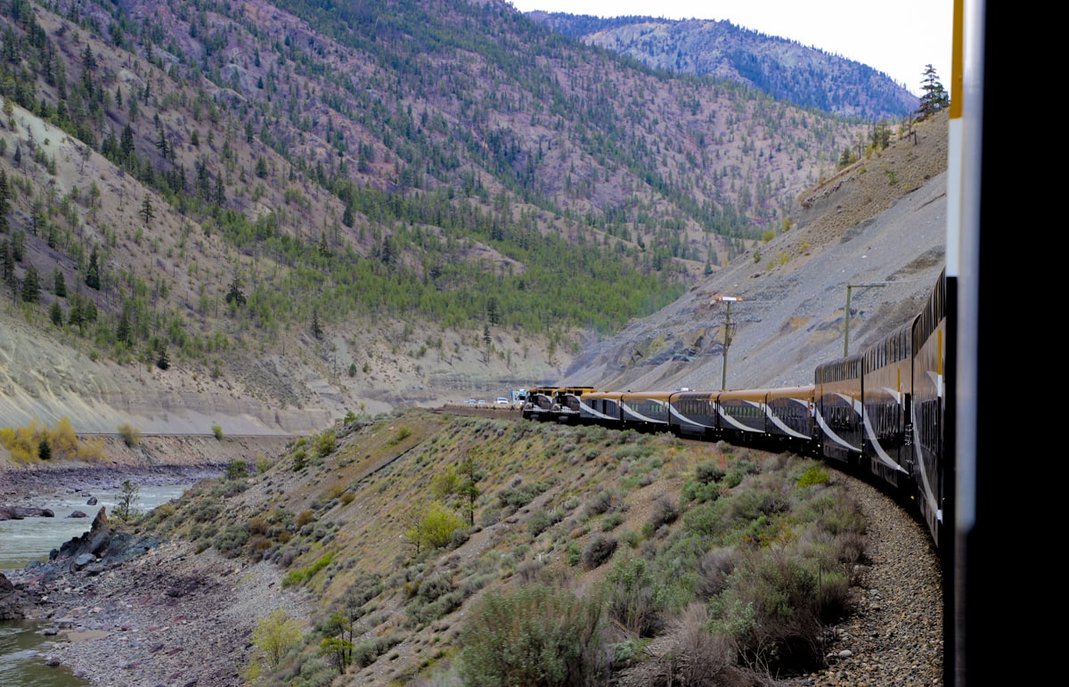 Rocky Mountaineer Train on side of mountain.