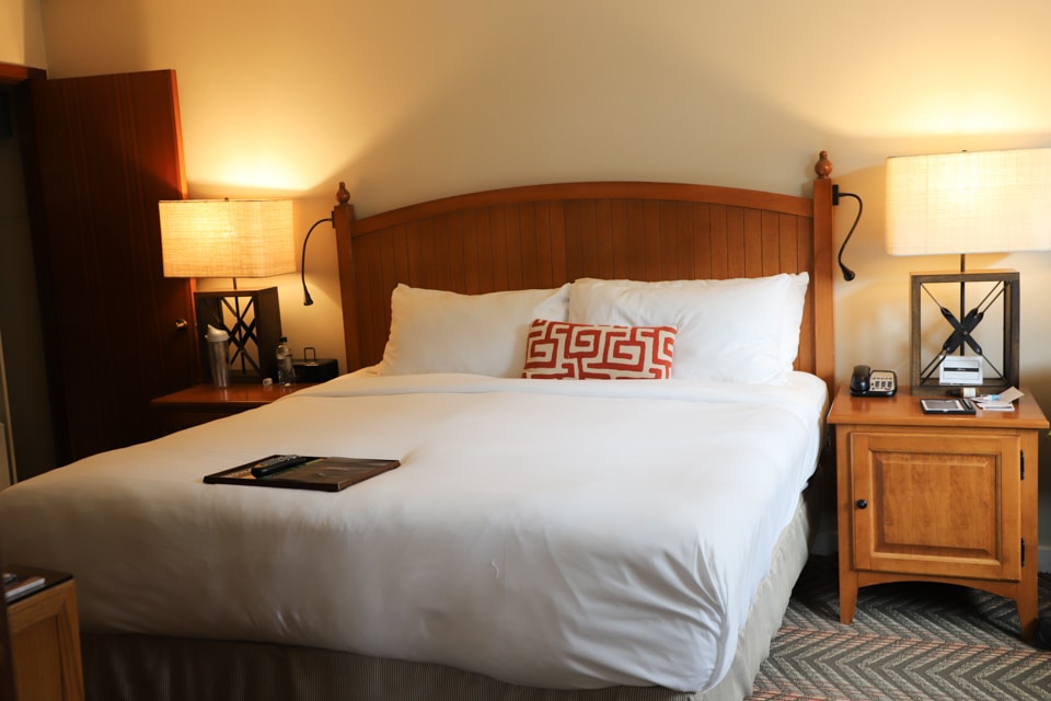 Bedroom with bed and two night stands.