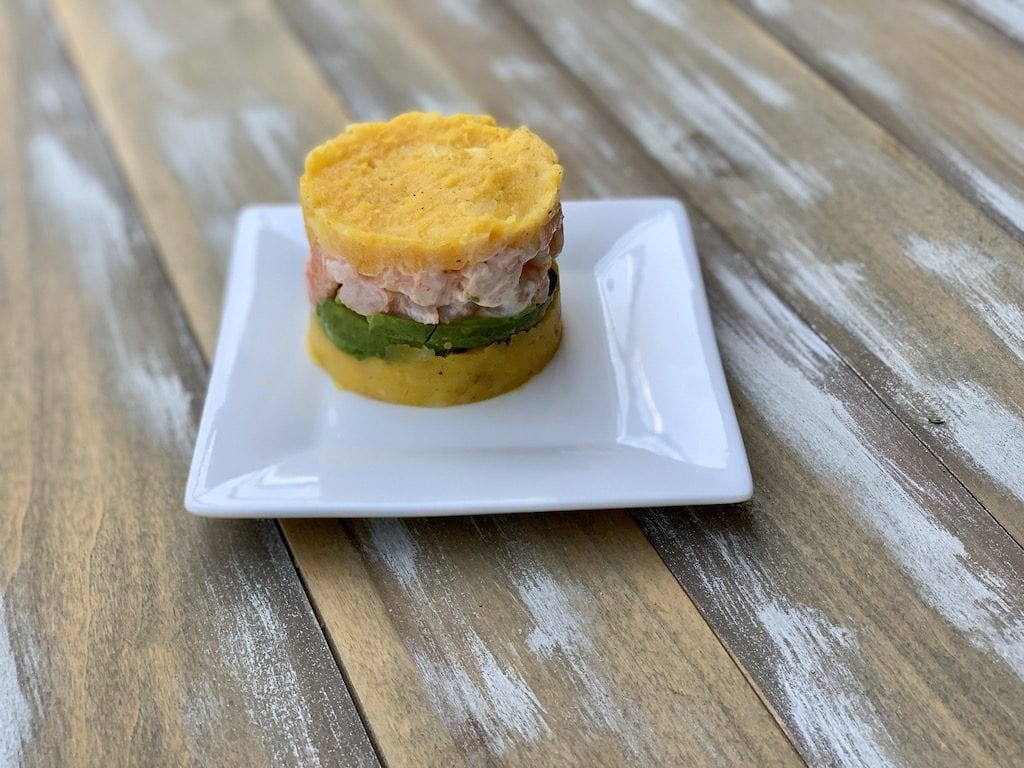 The Shrimp Causa I had on a food tour in Lima Peru last year was incredible. Have you ever eaten Peruvian food? #PeruvianFood #ShrimpRecipes #GAdventures