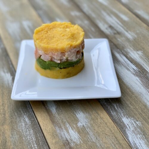 The Shrimp Causa I had on a food tour in Lima Peru last year was incredible. Have you ever eaten Peruvian food? #PeruvianFood #ShrimpRecipes #GAdventures