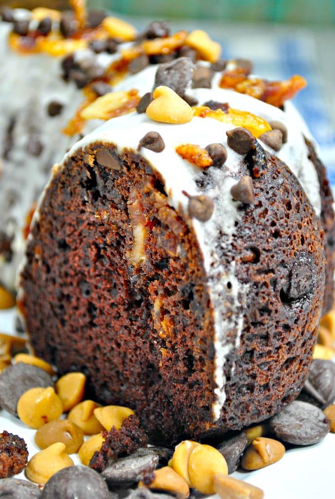 chocolate rum cake with icing on a white plate