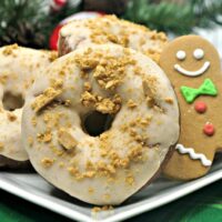 Christmas donuts on a white plate.
