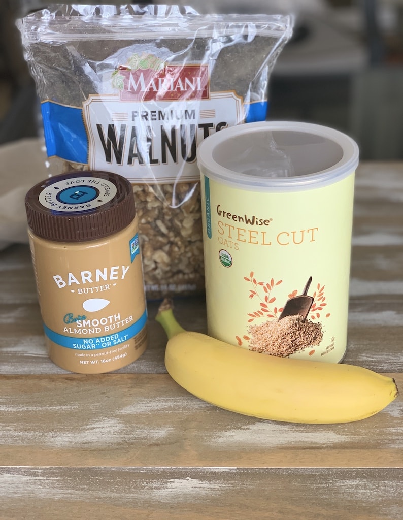 Ingredients of oatmeal, bananas, walnuts, and almond butter.