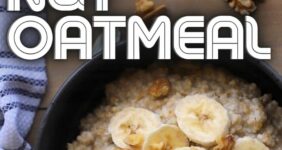 Oatmeal with banana and nuts in a black bowl.