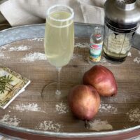 This pear martini recipe is for those of you who don't really like the taste of alcohol! Made with sparkling wine, muddled pear, and a pear liqueur, it's delightful!