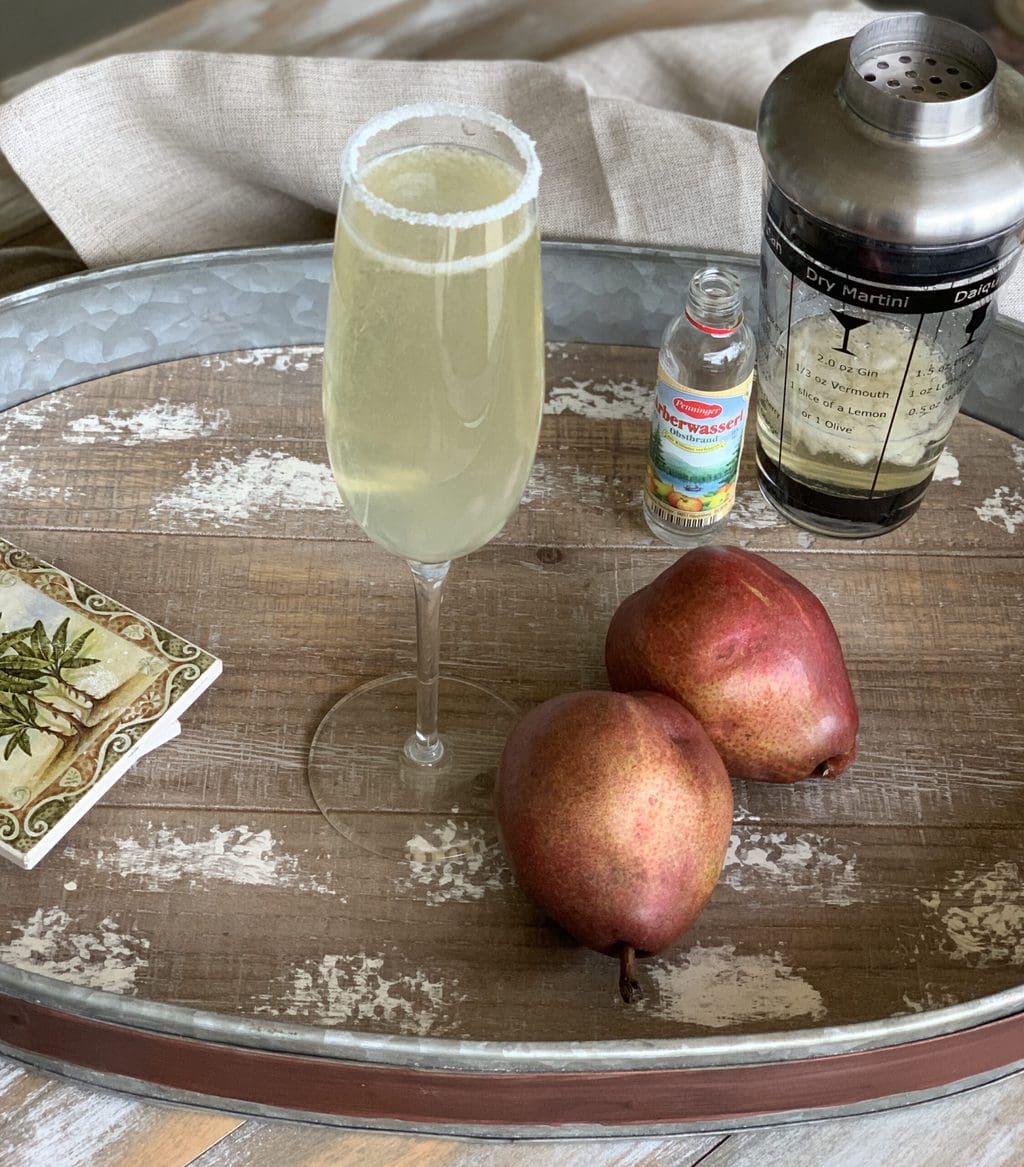 This pear martini recipe is for those of you who don't really like the taste of alcohol! Made with sparkling wine, muddled pear, and a pear liqueur, it's delightful!