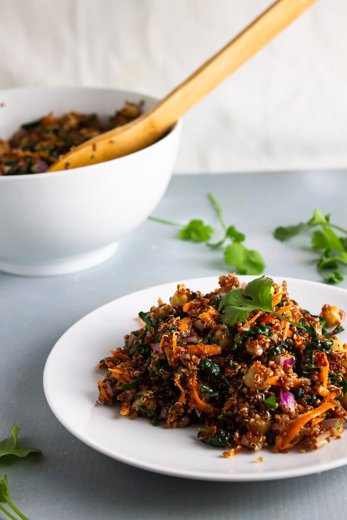 Quinoa salad in a white bowl.