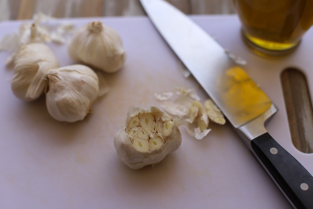 Knowing how to roast garlic cloves is important if you're planning to use roasted garlic in a dish or as a side with bread. Roasted garlic is creamy and delicious, and spreads like butter once it's roasted.