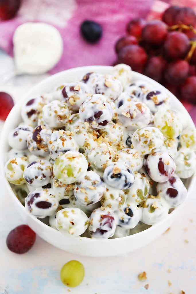 Grape salad in a white bowl.