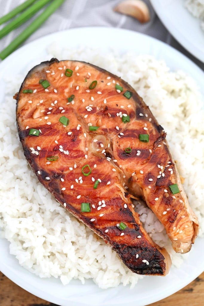 Grilled salmon on white rice.