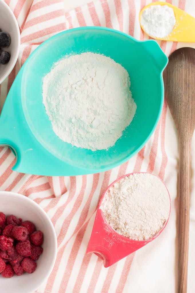bowls of flour on red and white striped tablecloth